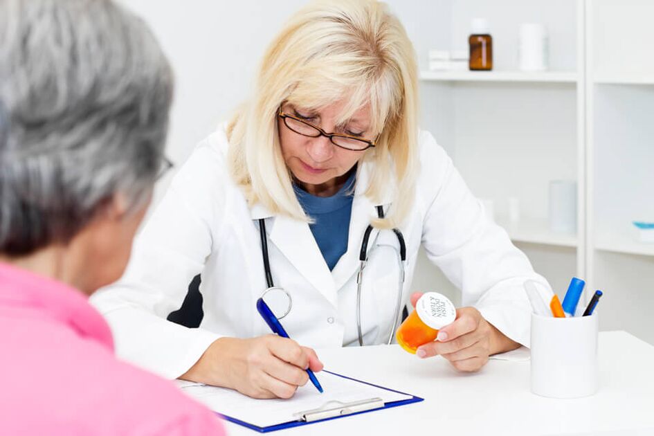 Doctor prescribing medication for hip joint pain